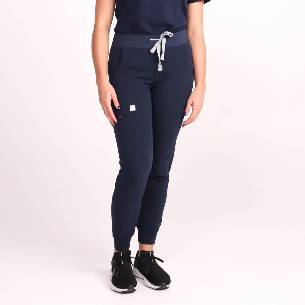 Nurse wearing Navy Medical Jogger Scrub Pants and Navy Medical Scrub Top from Fit Right Medical Scrubs Australia